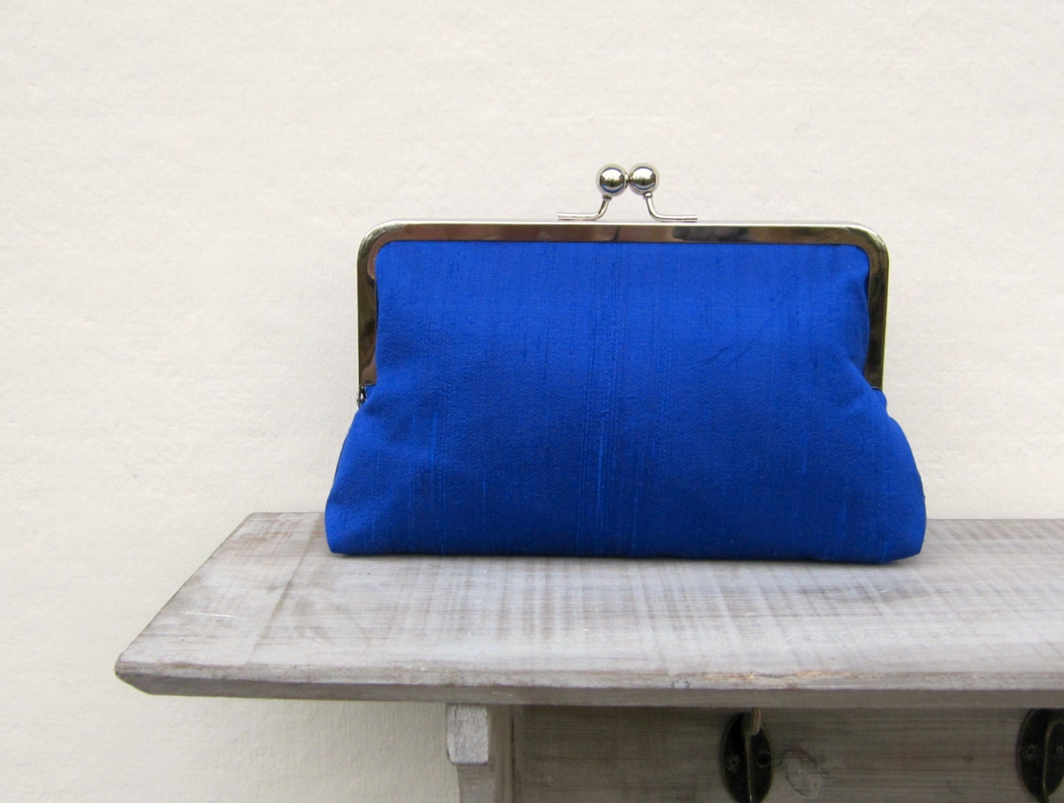 royal blue and silver clutch bag