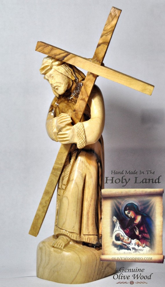 Easter olive wood carved statue of Jesus the Lord carrying the