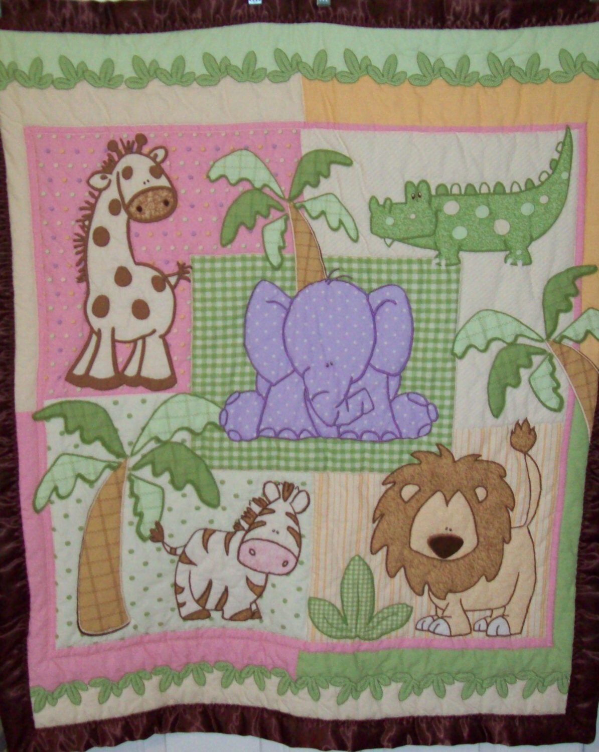 Hand-quilted Animal themed baby quilt.