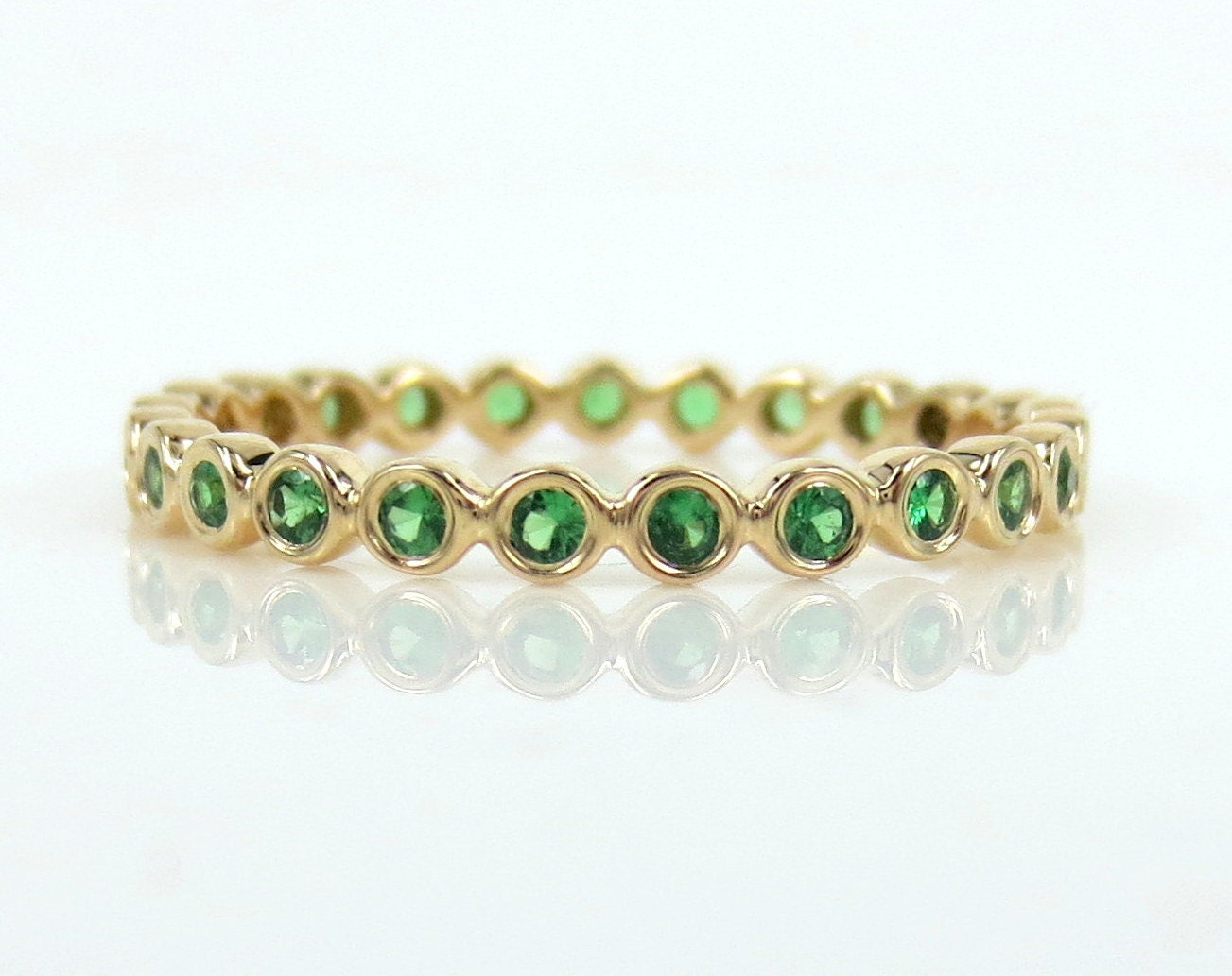 0.35 carat Bezel Set Round Tsavorite Eternity Band in 14k