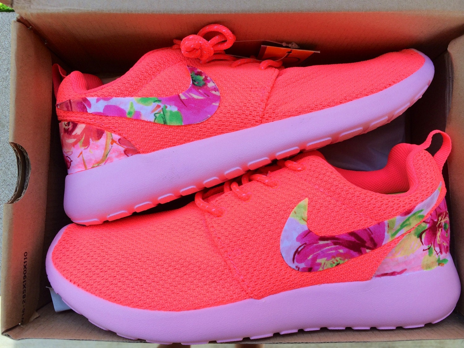 nike shoes with floral swoosh