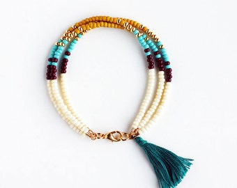 Multicolor Beaded Friendship Bracelet with Tassel - Cream Chocolate Butterscotch Yellow Turquoise Gold Peacock Green - Southwestern Jewelry