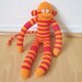 Chili pepper sock monkey plush doll - red and orange striped with red heart button