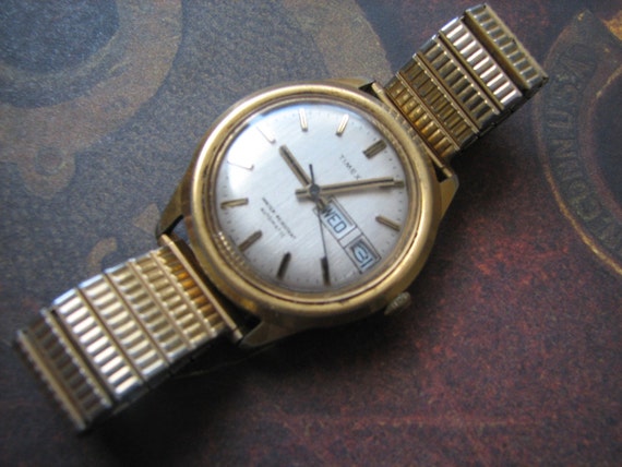 Men's vintage 60s Timex Automatic goldtone date wind up