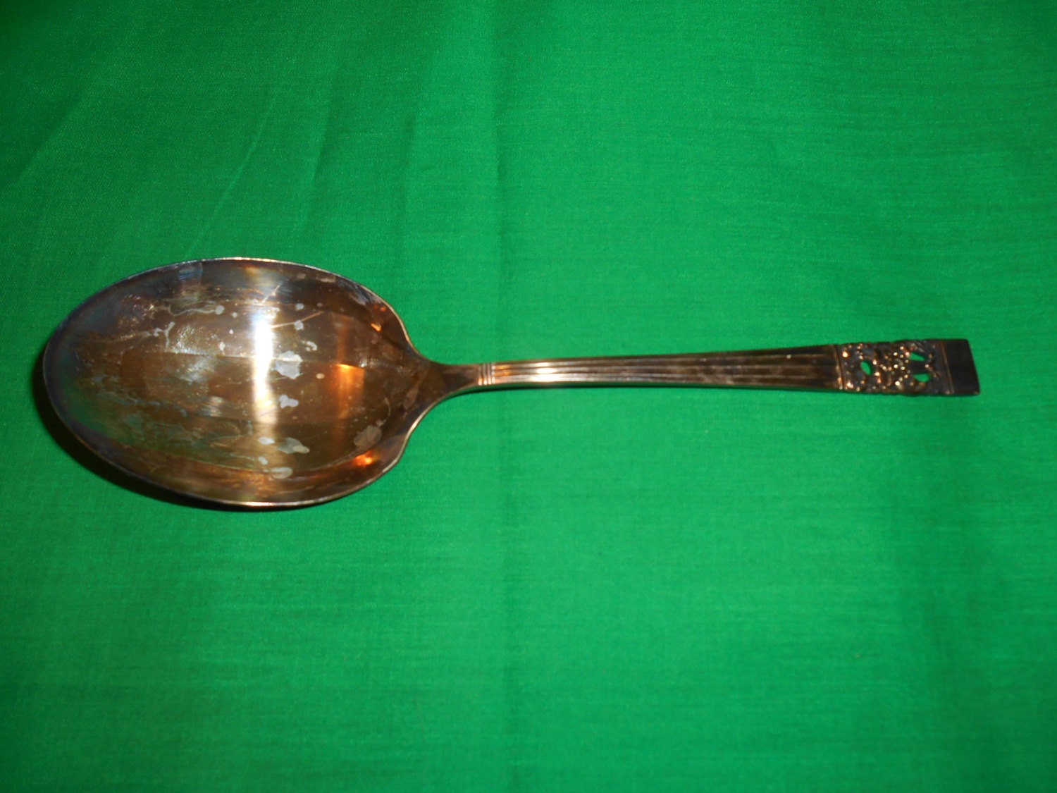 One (1), 8 5/8″ Silver Plated, Small Solid Berry / Casserole Spoon