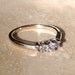 Reserved for Renay...High Quality Platinum and 14K Magic Glo 3 Stone Diamond Band Weighing 2.6 grams and Size 6.25