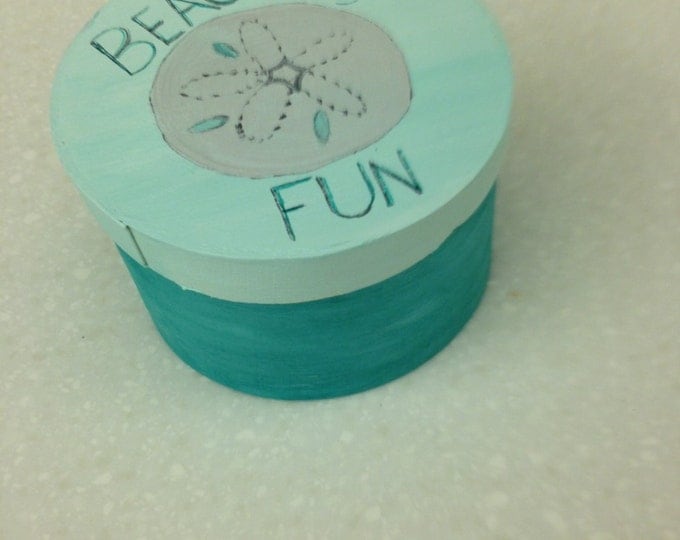 4 1/2" diameter round wood box with lid. Aqua with sand dollar and "Beach, Fun, Sun" on Top