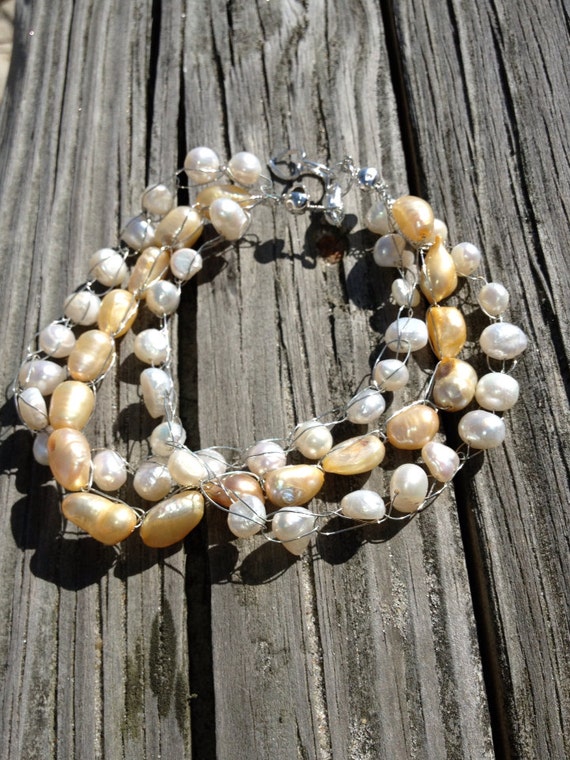 Items similar to Ivory and Parchment pearl bracelet on Etsy