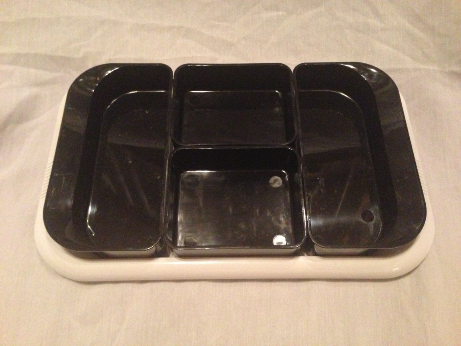 Square White Plate with Four Black Compartments from Isreal Haute Juice