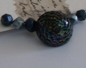Necklace. Recrafted. Vintage earring and beads. Peacock shade.