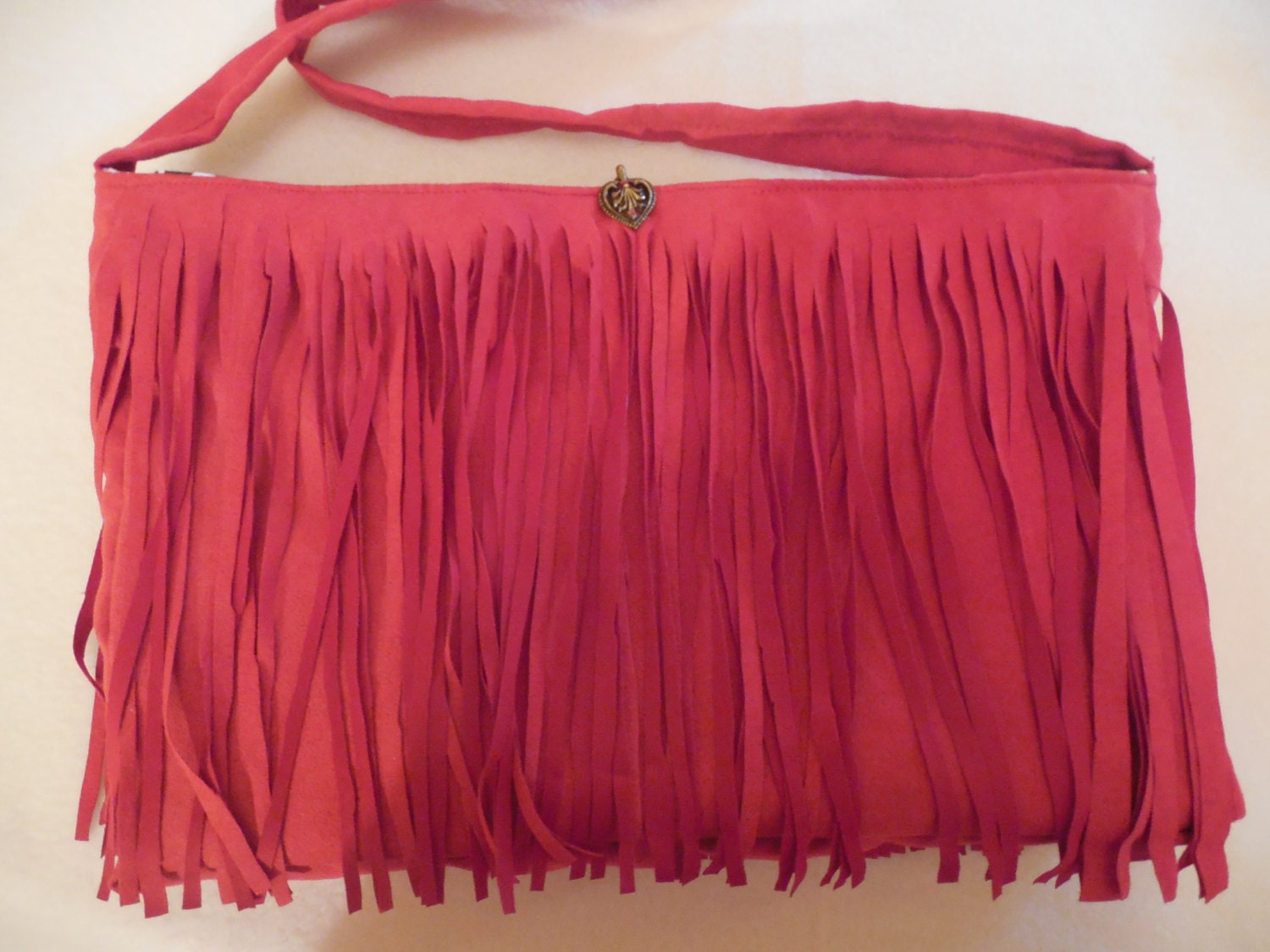 red fringed imitation suede purse