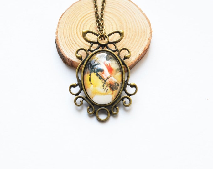 ART Oval pendant metal brass with the image of horses under glass