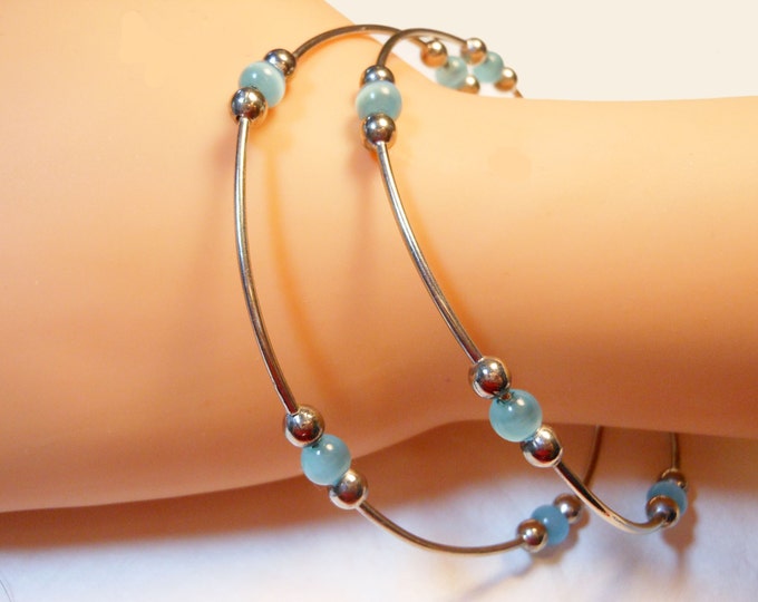 FREE SHIPPING Set of two silver plated bangles with light blue cat's eye glass beads vintage