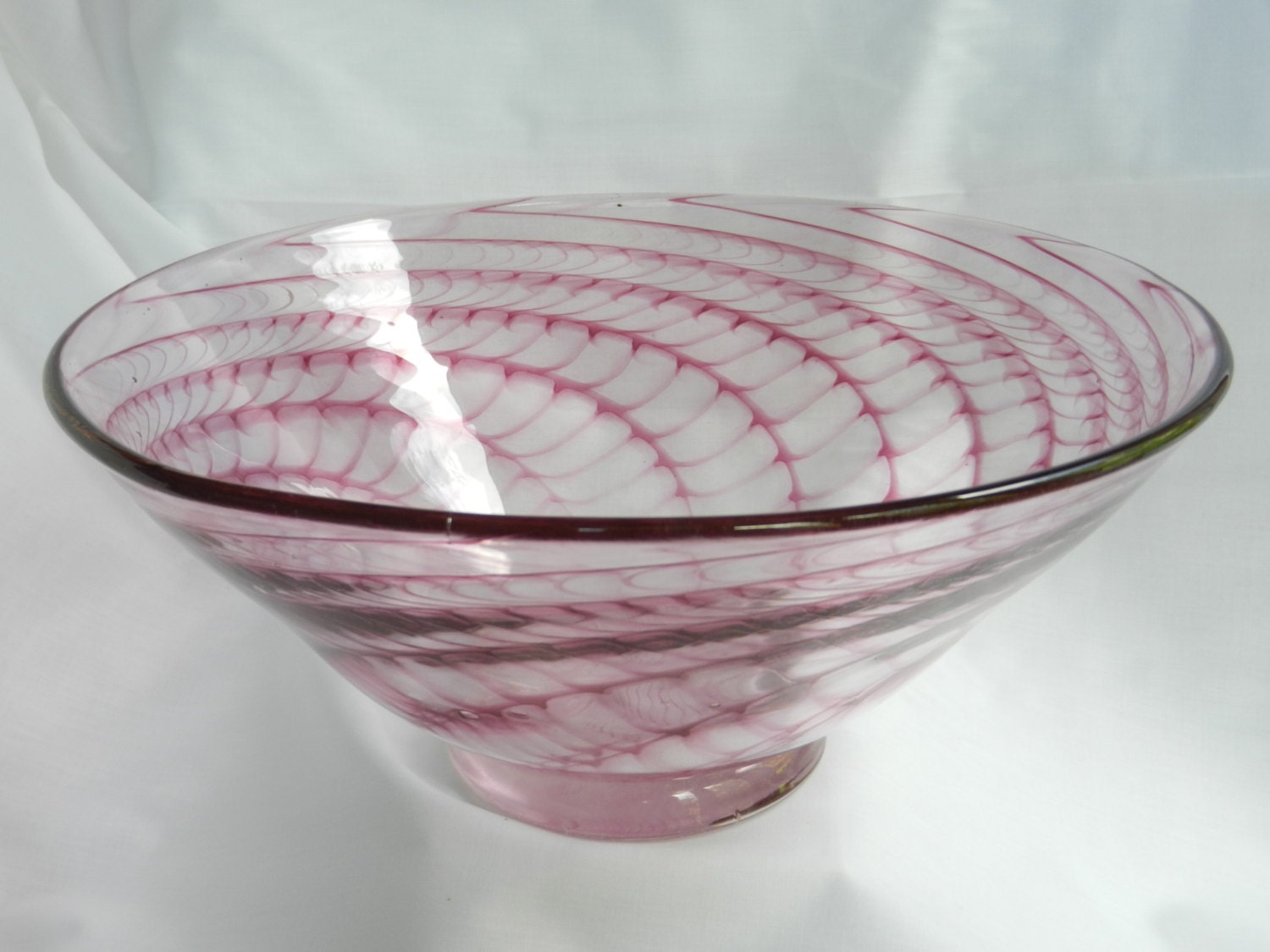 Handblown large cranberry glass bowl in herringbone spiral