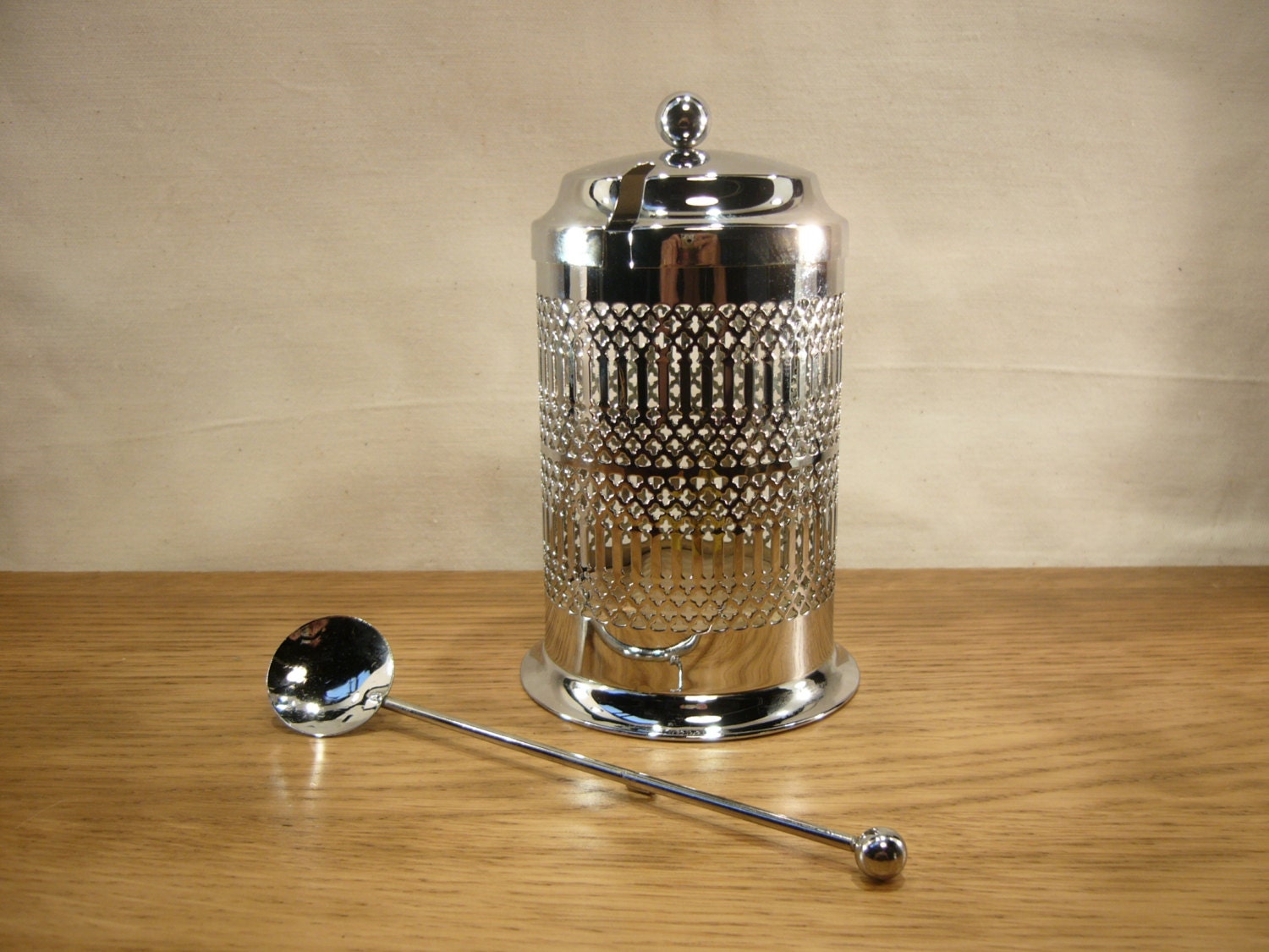 Vintage chrome plated preserve jar holder with pierced lattice