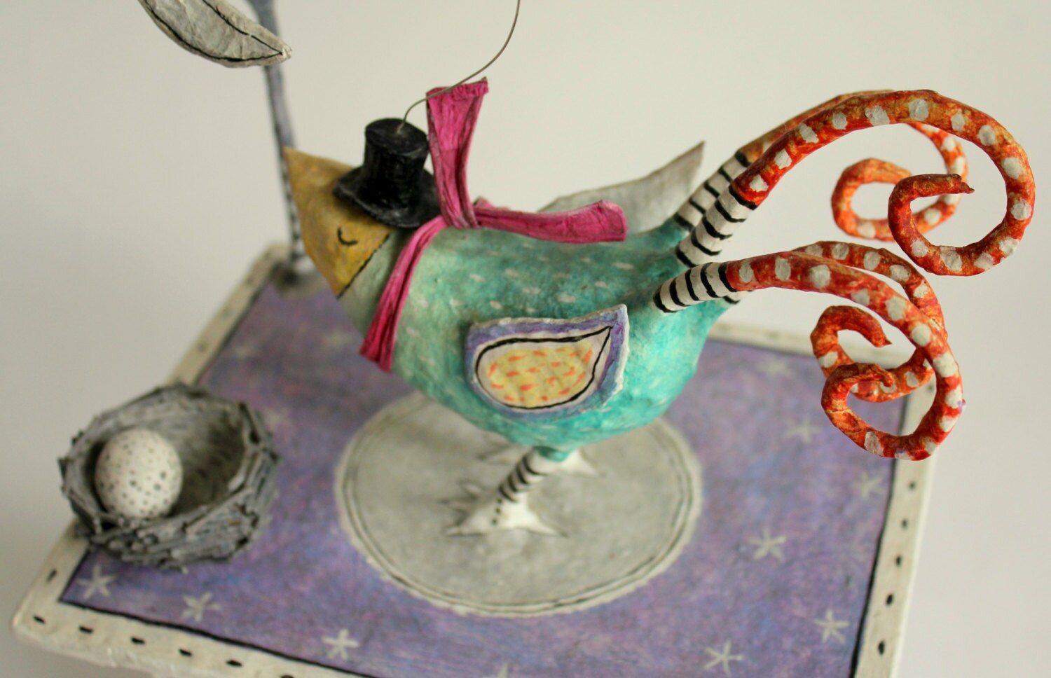 Papier mache box bird sculpture. Bird with warm by