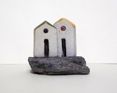 Ceramic miniature houses , ceramic sculpture of two tiny houses on a natural Granite stone with shiny Quartz crystals , collectible item
