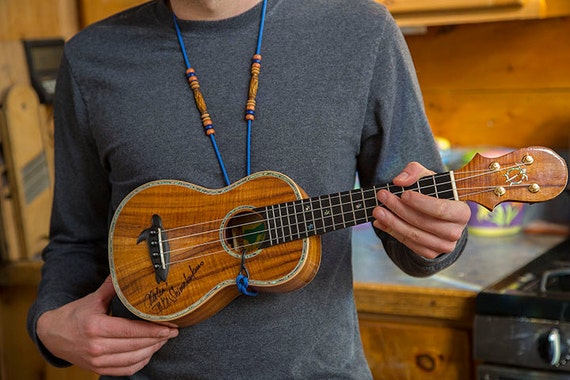Handmade beaded adjustable ukulele strap that hooks in to the