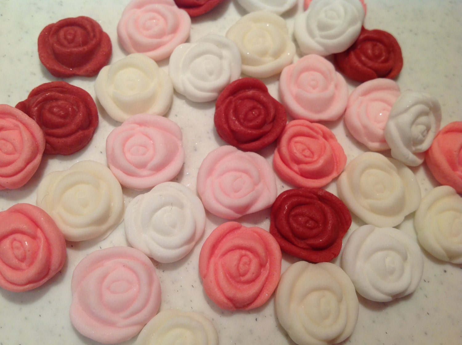 Edible sugar rose buds to match the larger roses cupcake