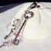 Silver necklace, sterling silver necklace with teapot, vial of potion, key charms and Crystals elements