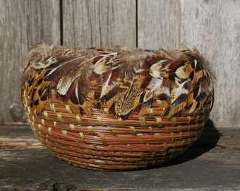 Coiled Pine Needle Basket with pheasant feathers