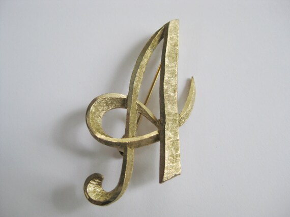 Items similar to Gold Tone Letter 