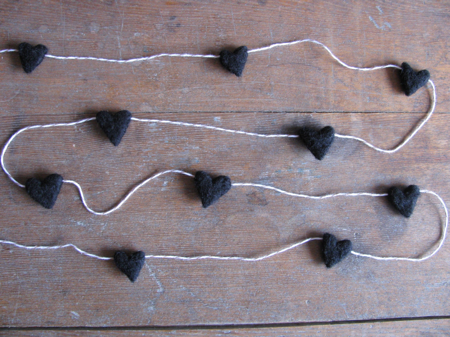 Felted wool heart garland Black on red striped baker's