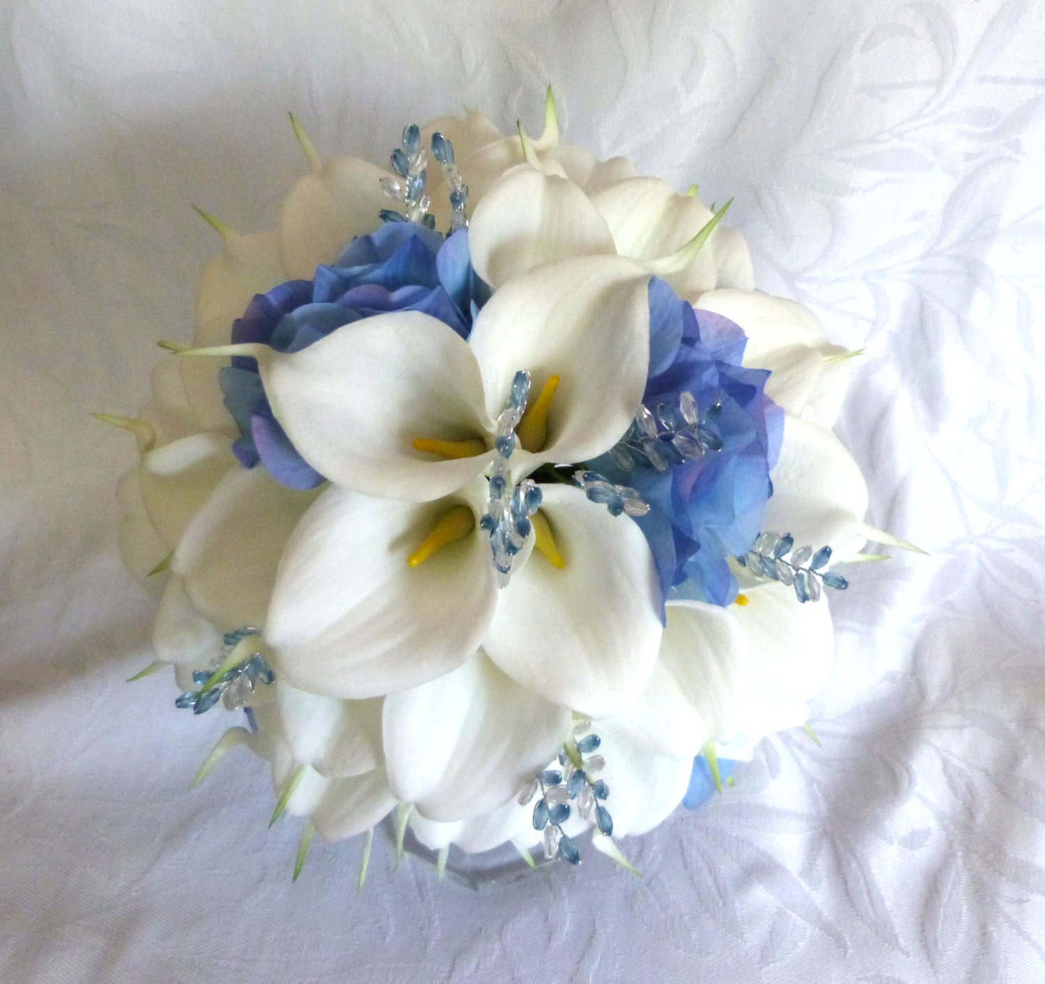 White Calla lily with blue hydrangea wedding bouquet Real