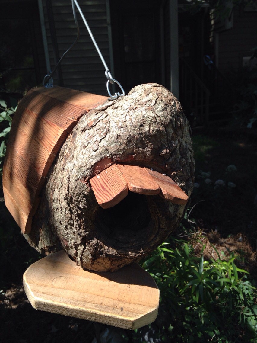 Natural tree stump birdhouse