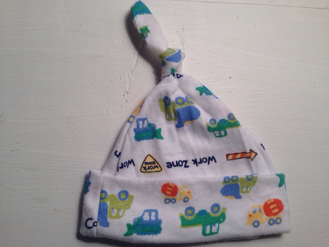 Infant topknot hat. White construction zone theme. 03 months.