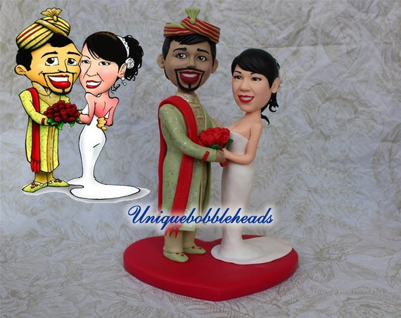 Custom wedding cake toppers/cartoon looking bride and groom