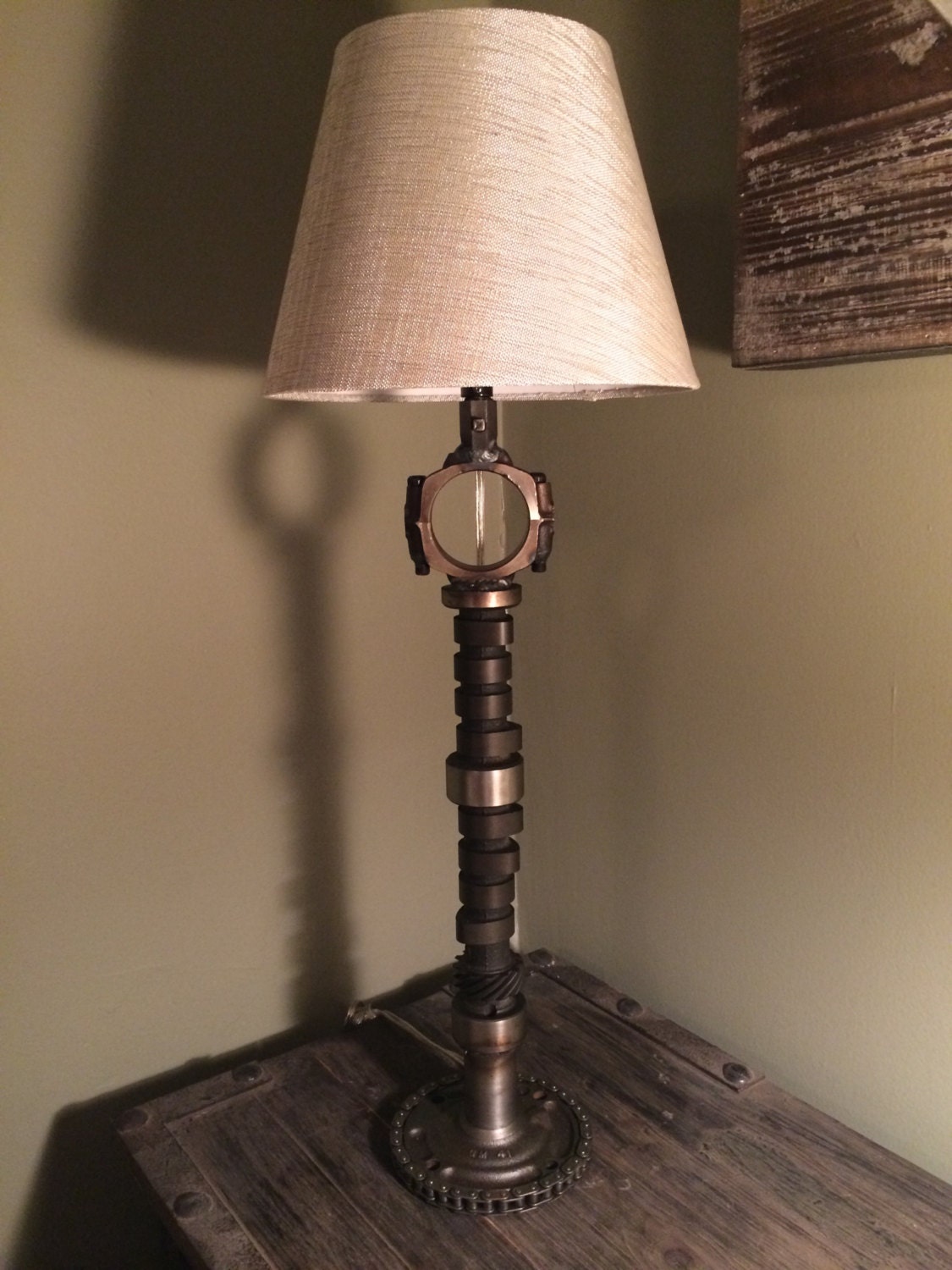 Hand crafted table lamp using repurposed engine/car parts.