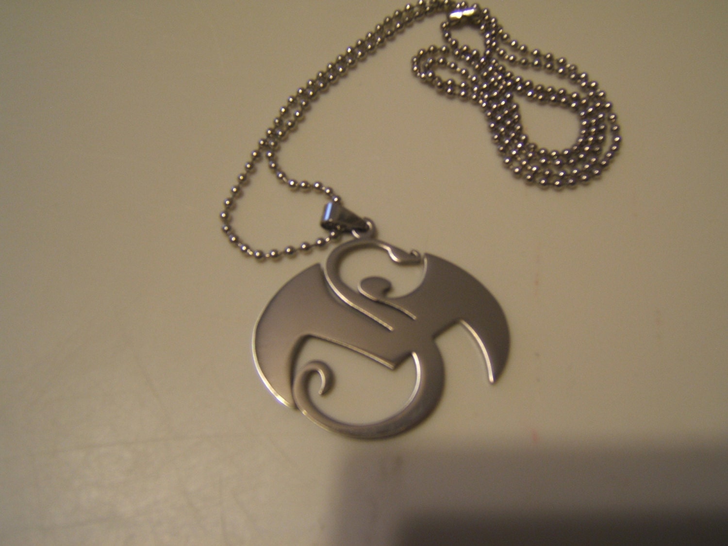 Tech N9ne Strange Music stainless steel pendant with a 30 inch