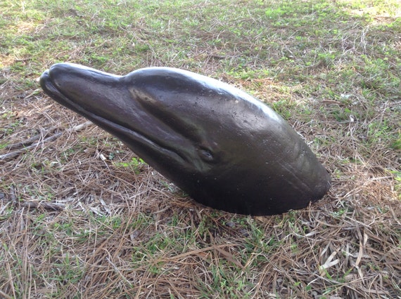 cement dolphin statue