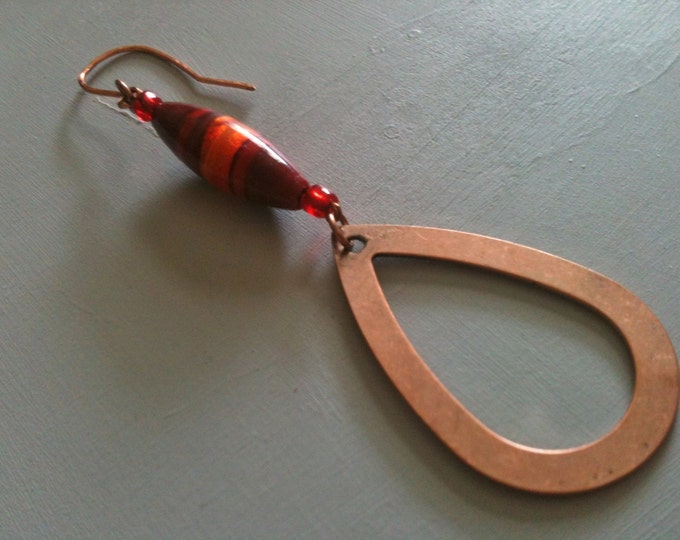 copper earrings with red and orange glass beads