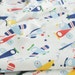 3333 - Toy Aeroplane Cotton Jersey Knit Fabric - 70 Inch (Width) x 1/2 Yard (Length)