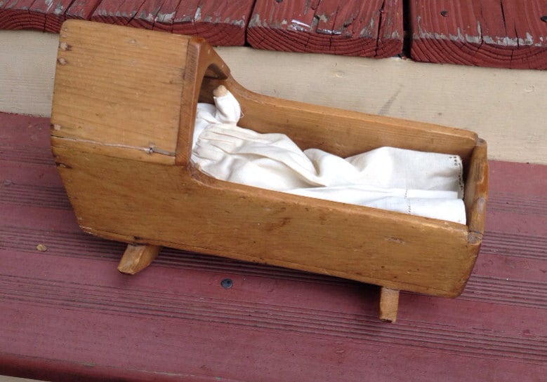 Antique Doll Cradle and doll Haute Juice