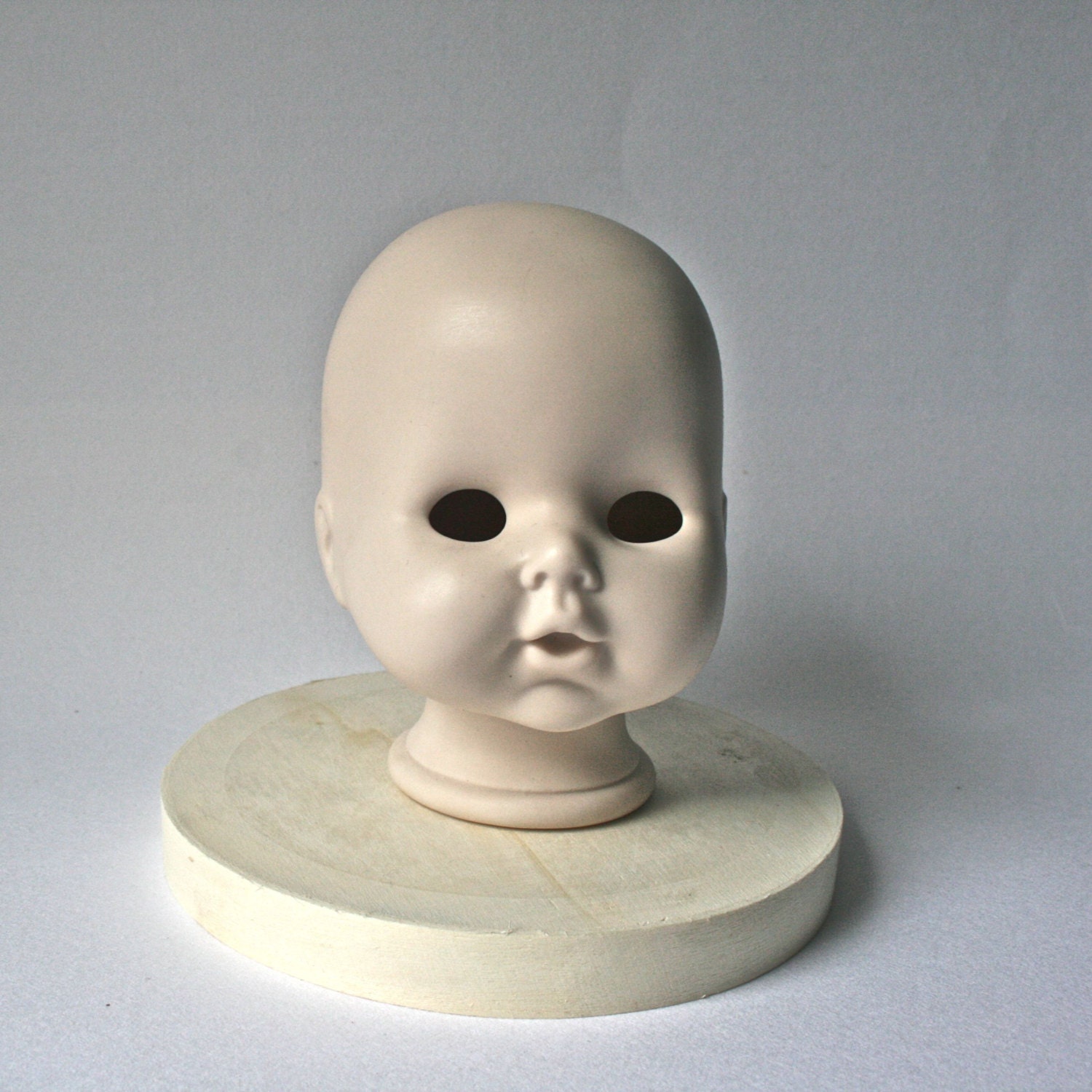 Vintage Porcelain Bald Doll Head with Sweet Expression for
