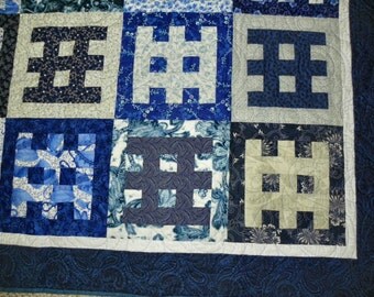 Blue and white "Gates of Serenity" lap quilt