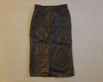 1980's, black, leather, long pencil skirt, with snaps at the bottom of the back