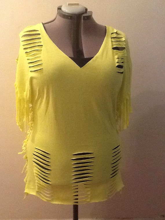 Bright yellow cut up t shirt with side tie up and tasseled