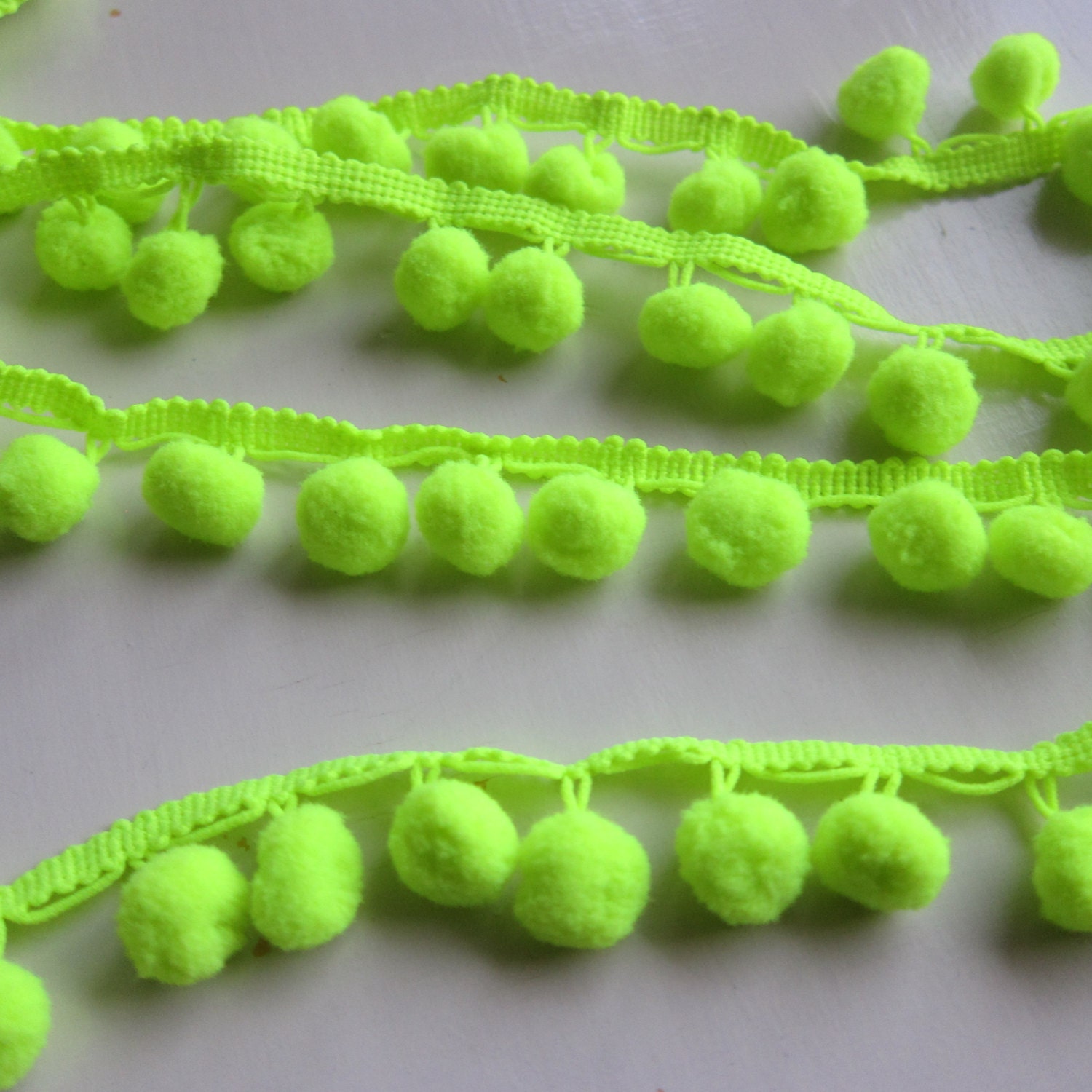 yard the trim by pom pom pom neon green AmadeusCoutureSupply Fluo neon pom by yard trim