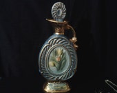 1973 collectable Jim Beam Whiskey decanter. porcelain china with tulip design, blue, pastels, and gold leaf accent.