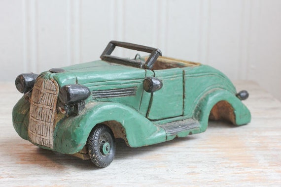 hand carved wooden cars