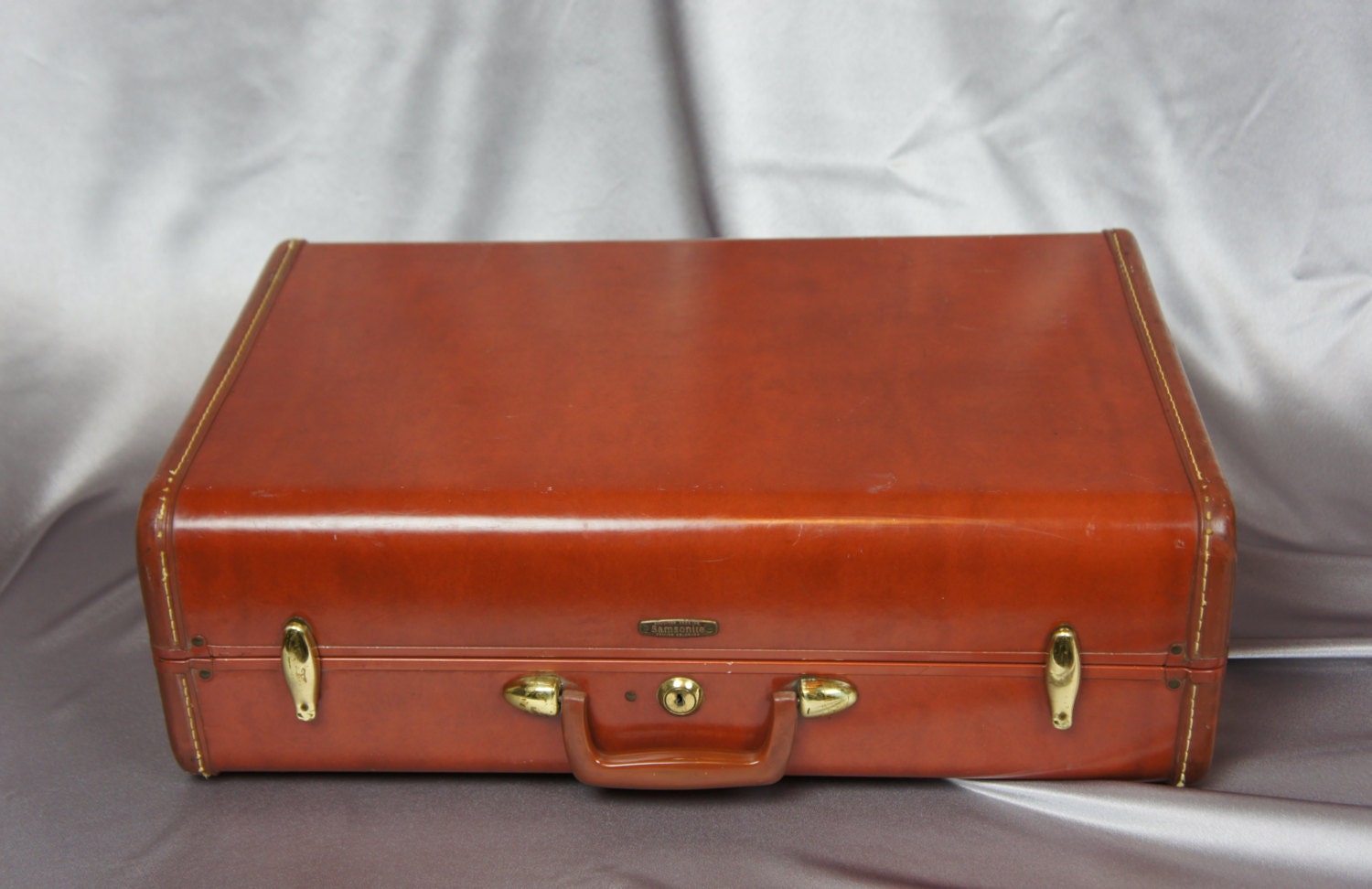 Brown hard shell leather suitcase Samsonite luggage style