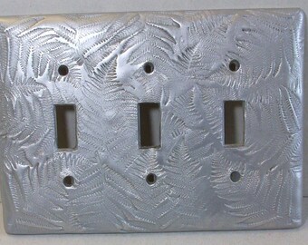 Silver Ferns triple toggle light switch cover