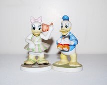 donald and daisy duck figurines