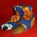 Child's Sports Slippers non-skid sole sz lg. Blue fleece with basketballs, footballs, soccer balls