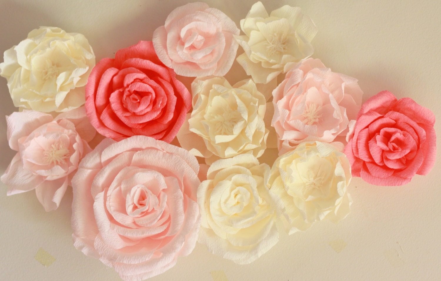 Giant paper flower display with roses and peonies. Shop window
