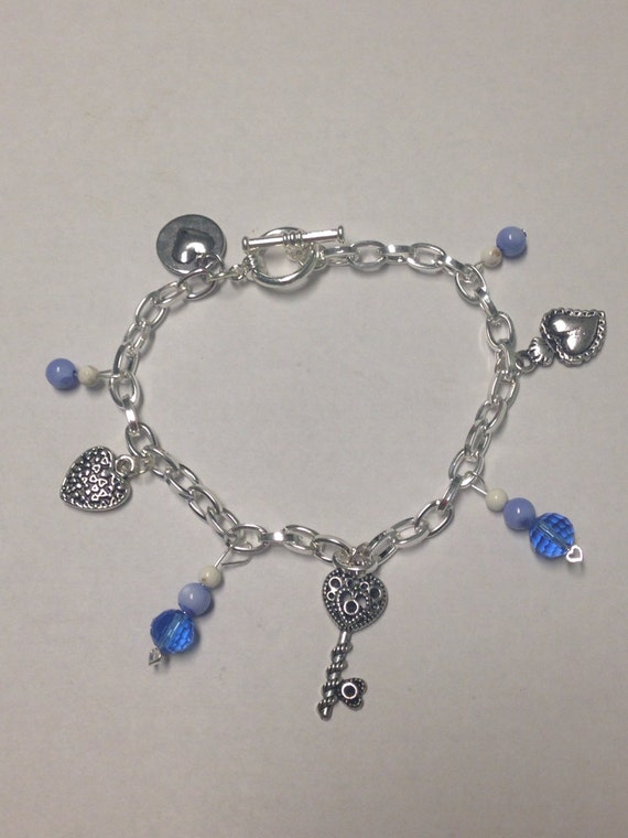 Items similar to Silver Heart Charm Bracelet with Blue Beads Charm